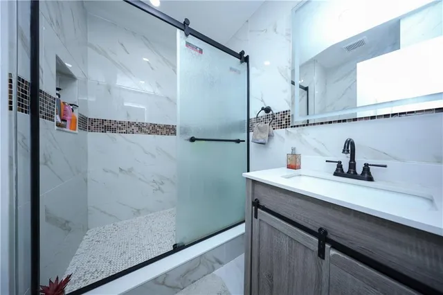 a bathroom with a sink and a mirror