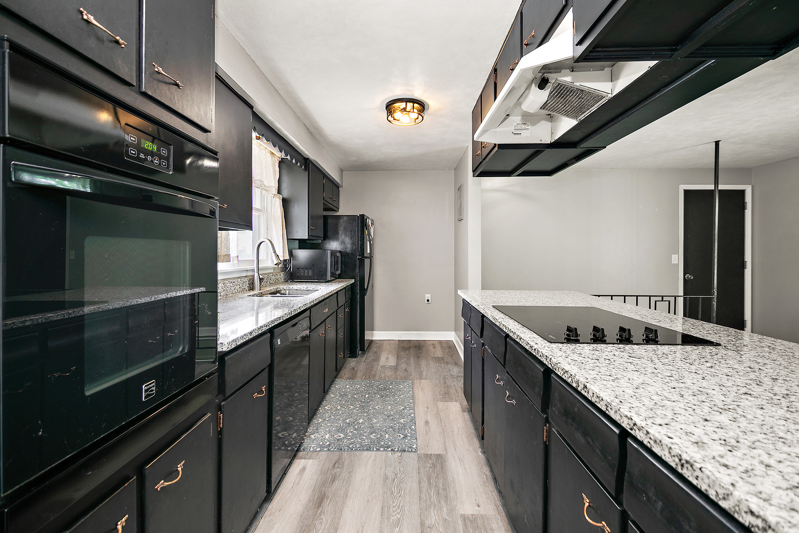 1572 North 2000E Road Bourbonnais, IL 60914 - Photo 7 of 18 a kitchen with stainless steel appliances granite countertop a sink and a stove