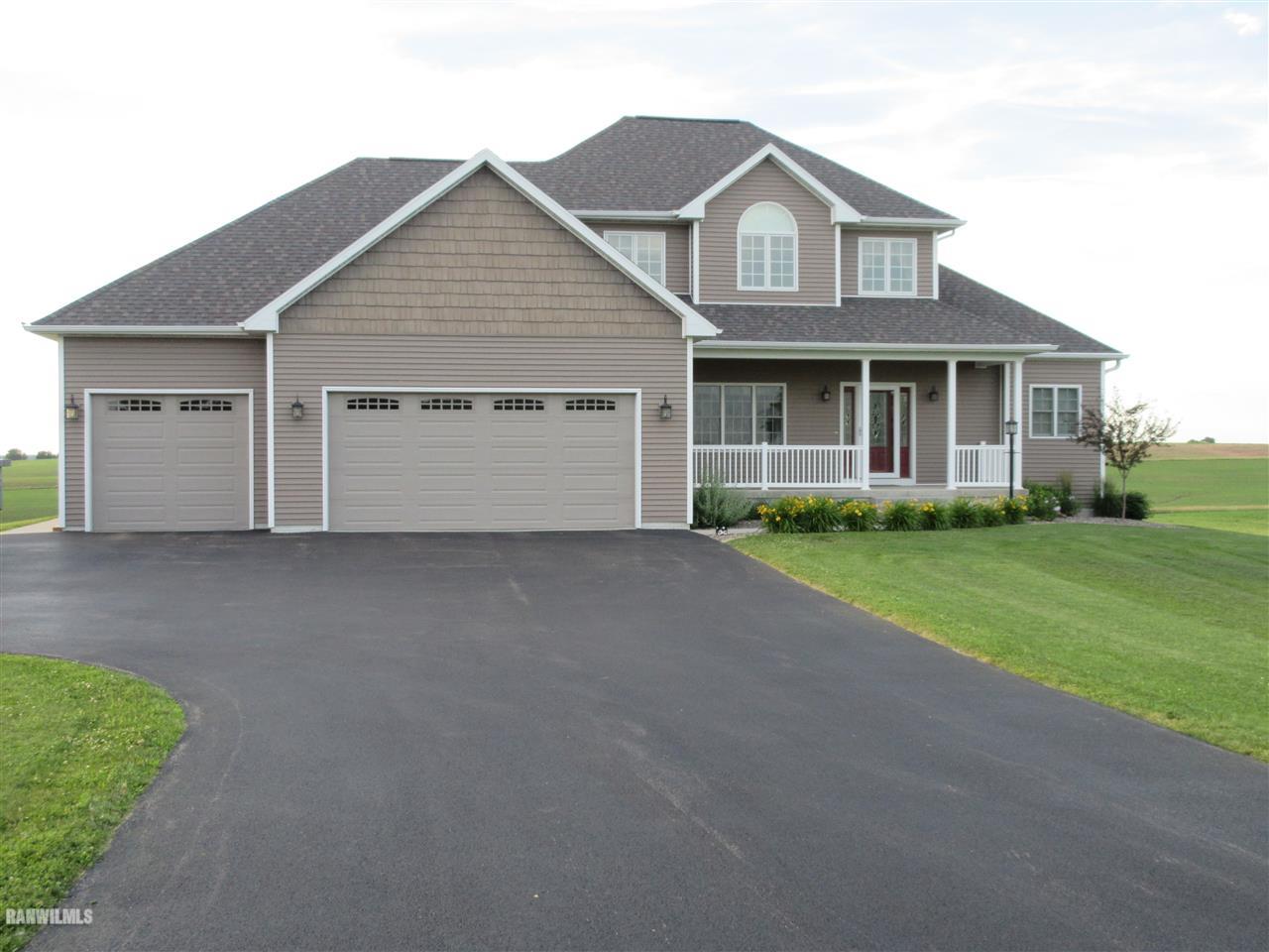 21855 Argo Fay Route Chadwick, IL 61014 - Photo 20 of 26 a front view of a house with a yard and garage