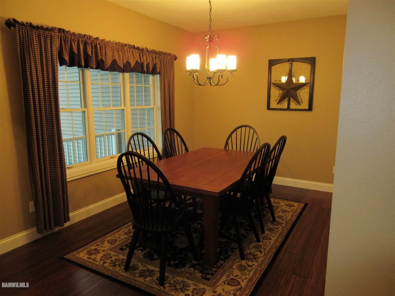 21855 Argo Fay Route Chadwick, IL 61014 - Photo 10 of 26 a view of a dining room with furniture window and wooden floor