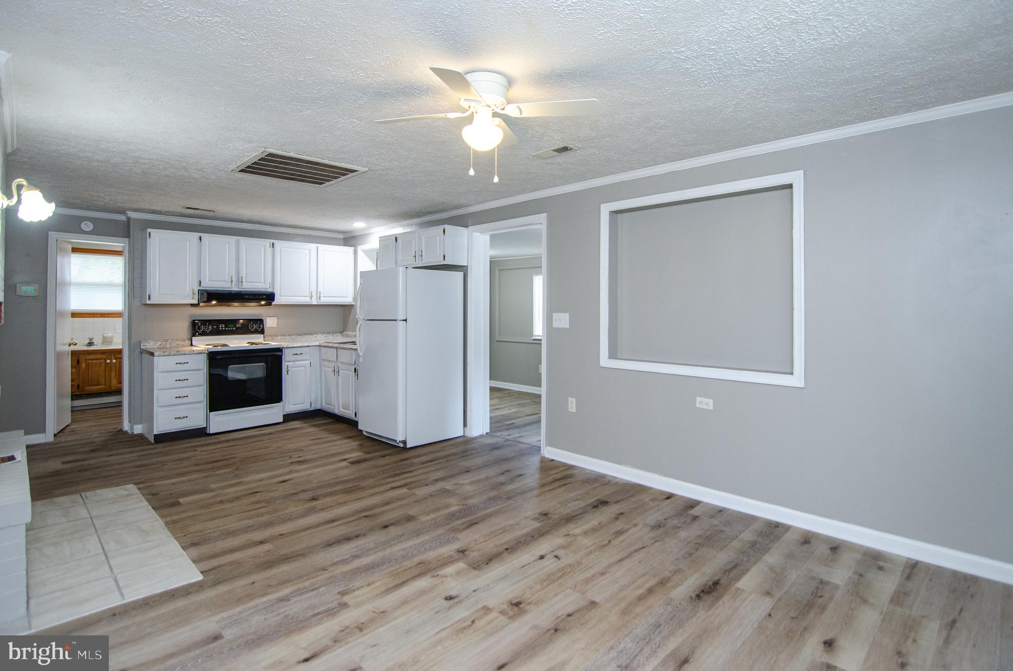 311 Rolando Drive Colonial Beach, VA 22443 - Photo 13 of 24 Kitchen Living room area.