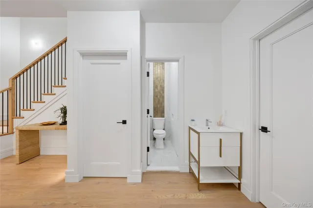 a bedroom with furniture and a wooden floor