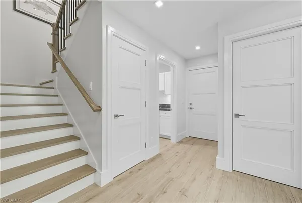 a view of entryway with wooden floor