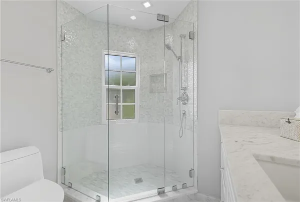 a bathroom with a shower and toilet