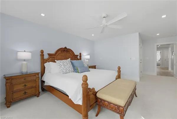 a bed room with a bed and a lamp