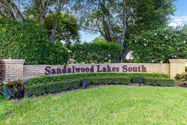 a view of garden with white house
