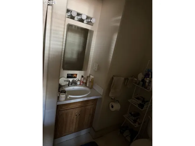 a bathroom with a sink and mirror