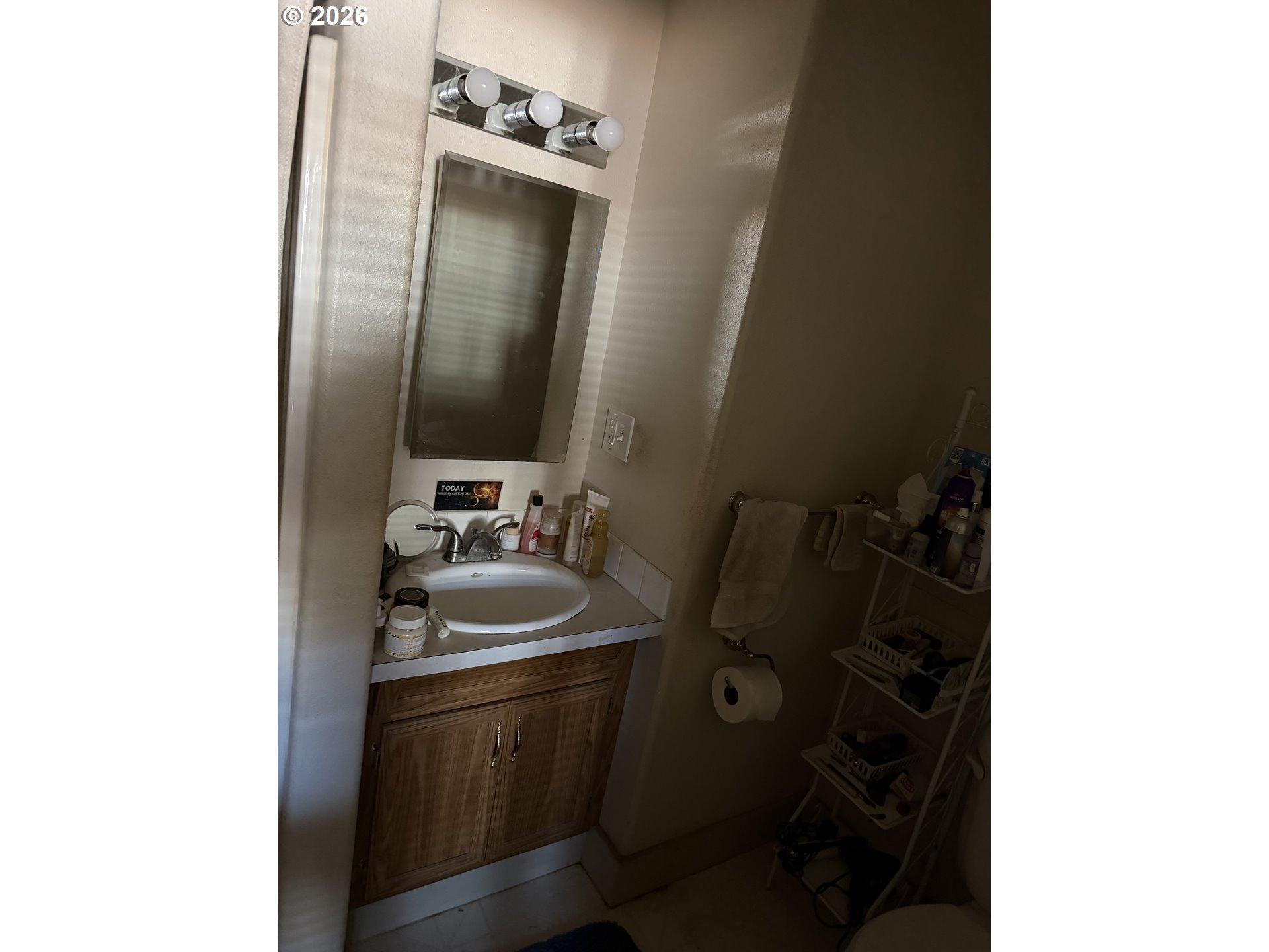 5205 Southeast Ramona Street Portland, OR 97206 - Photo 5 of 10 a bathroom with a sink and mirror