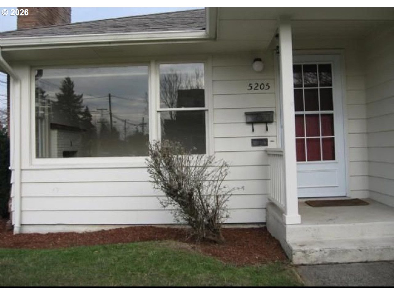 5205 Southeast Ramona Street Portland, OR 97206 - Photo 6 of 10 a view of front door and potted plants