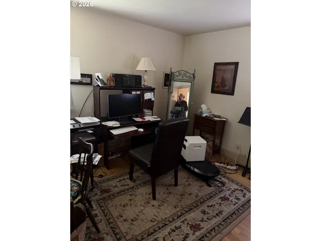 a view of a workspace with furniture