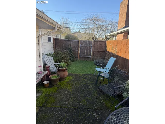 a view of yard with patio