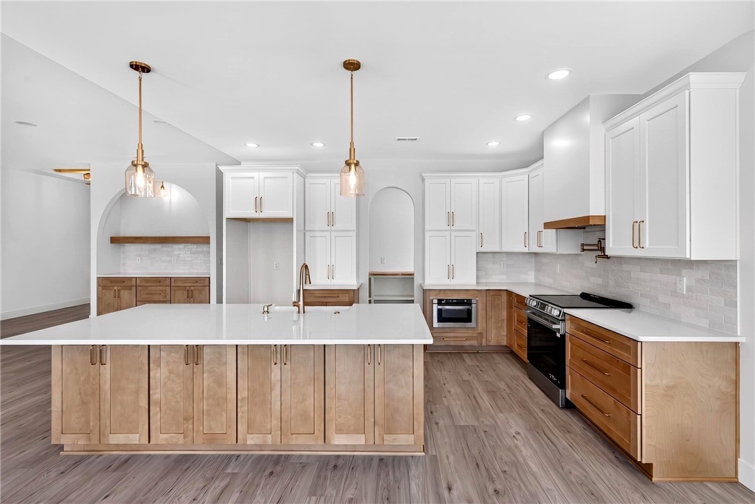 424 Blume Road Anderson, SC 29625 - Photo 12 of 30 Culinary aspirations find their home in this kitchen, featuring an expansive island, generous cabinetry, and integrated appliances.