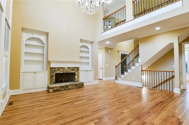 a kitchen with kitchen island granite countertop a stove sink and cabinets