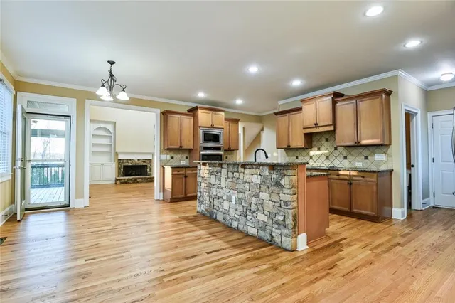 a view of livingroom with hardwood floor and a ceiling fan
