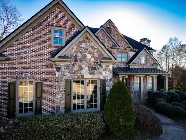 a front view of a house with garden