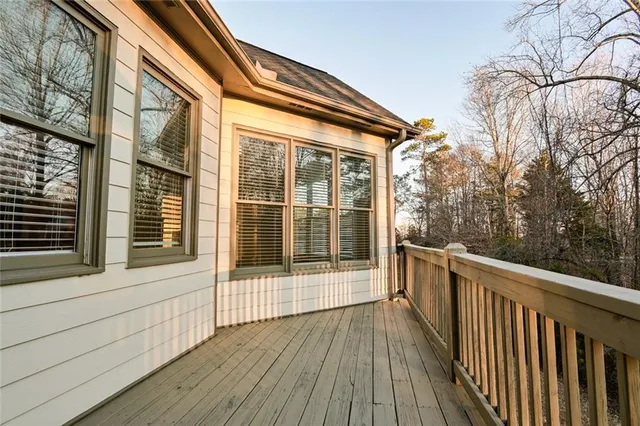 an empty room with closet and a chandelier fan
