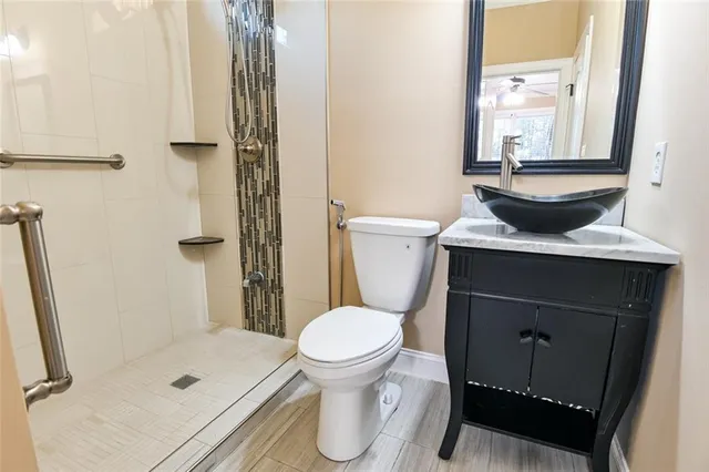 a bathroom with a shower and a bath tub