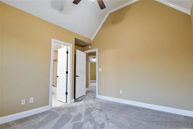 a view of a room with wooden floor and windows