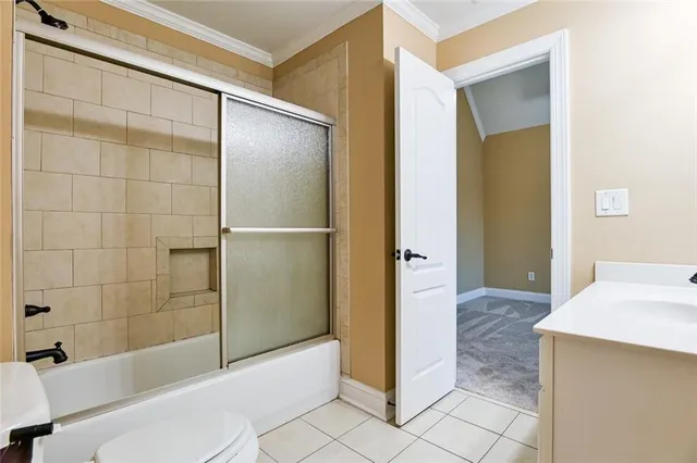 a bathroom with a double vanity sink a mirror and a bathtub