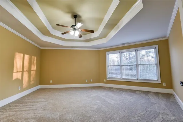 an empty room with closet and a bathroom
