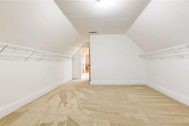 a view of a big room with wooden floor and cabinet