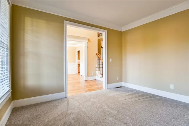 a view of staircase with wooden floor and a window