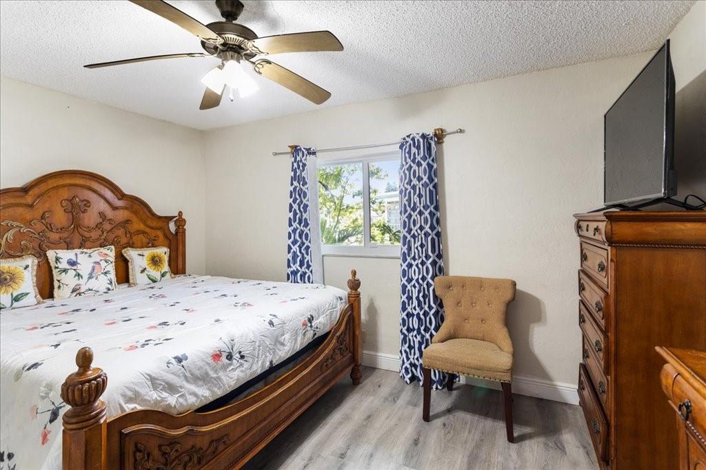 6800 Northwest 75th Drive Tamarac, FL 33321 - Photo 12 of 20 a bedroom with a bed and a chair