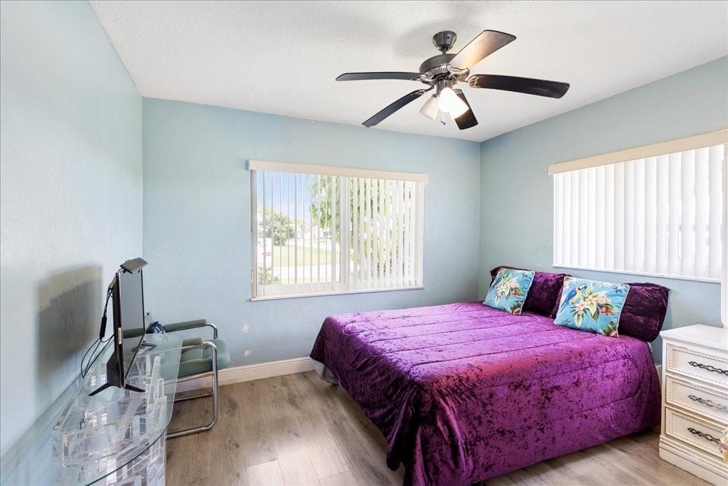 6800 Northwest 75th Drive Tamarac, FL 33321 - Photo 15 of 20 a bedroom with a bed dresser and a window