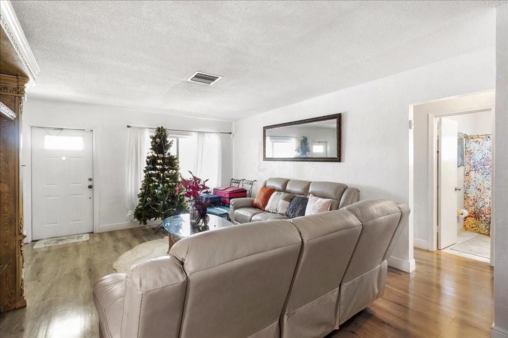 6800 Northwest 75th Drive Tamarac, FL 33321 - Photo 5 of 20 a living room with furniture and flowers