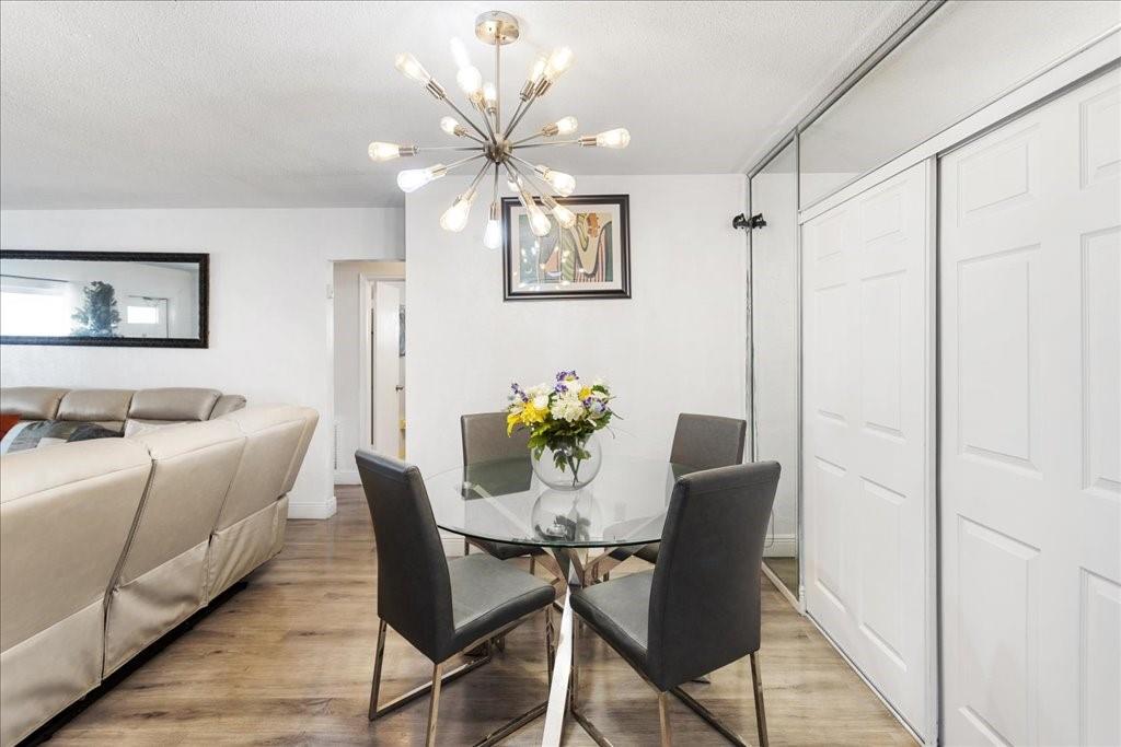 6800 Northwest 75th Drive Tamarac, FL 33321 - Photo 6 of 20 a view of a dining room with furniture and wooden floor