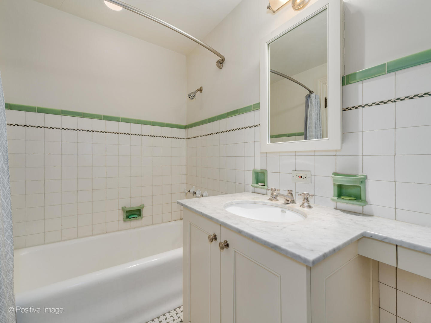 Undisclosed Address Chicago, IL 60611 - Photo 11 of 15 a bathroom with a sink and a bathtub