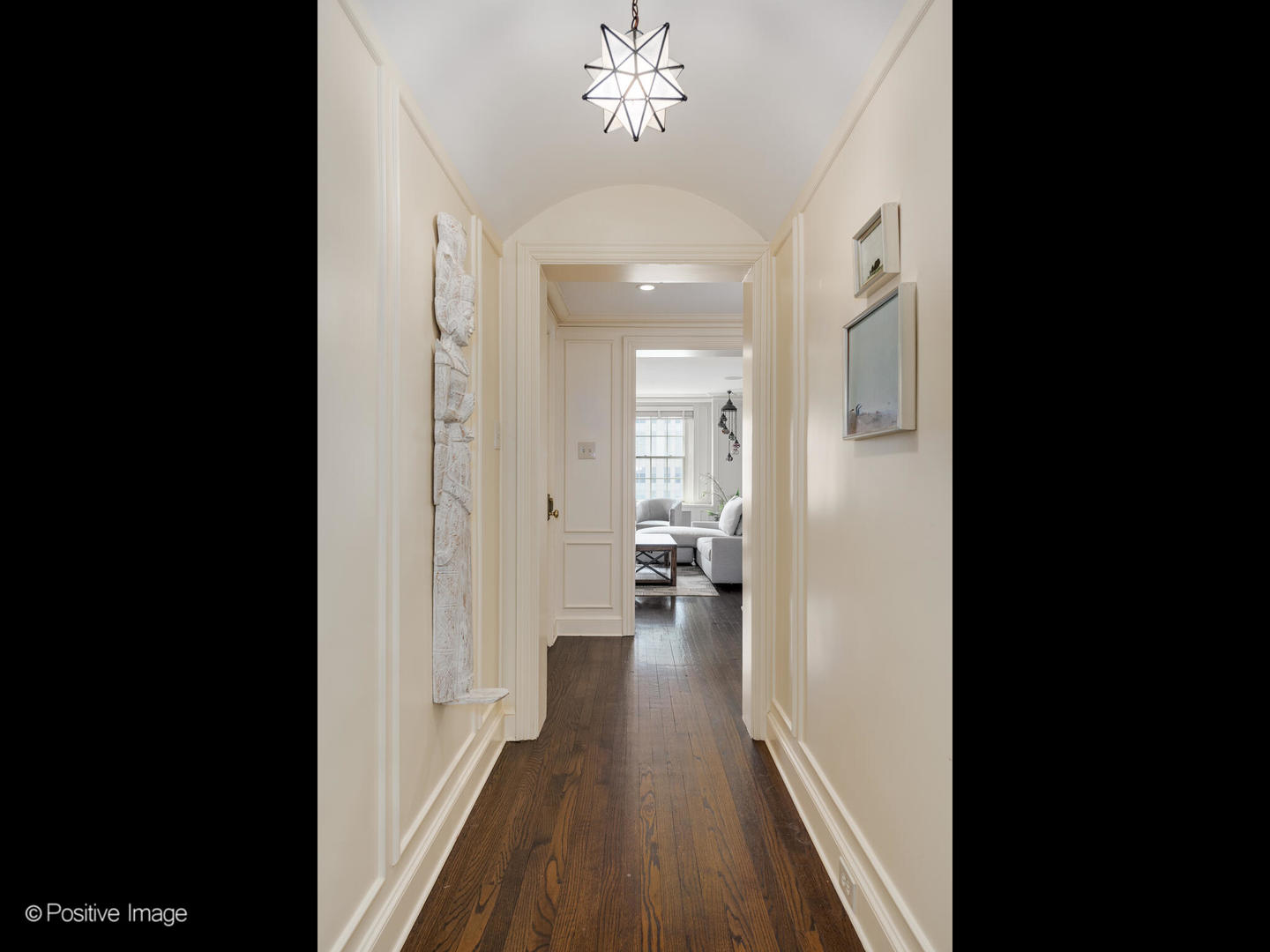 Undisclosed Address Chicago, IL 60611 - Photo 9 of 15 a view of a hallway with wooden floor and a living room
