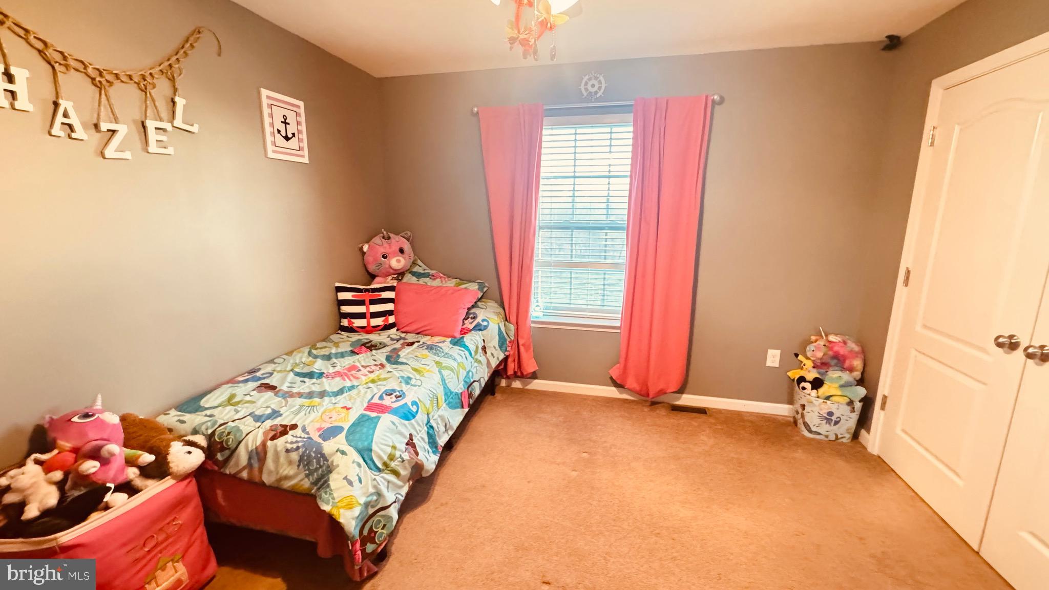 2295 Harney Road Littlestown, PA 17340 - Photo 14 of 37 a bedroom with a bed and a window