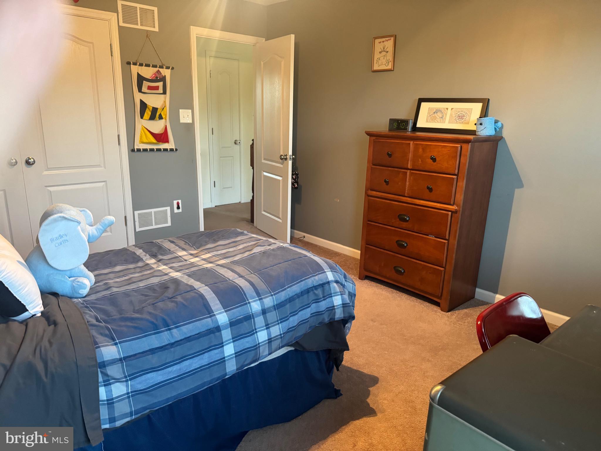2295 Harney Road Littlestown, PA 17340 - Photo 18 of 37 a bedroom with a bed and cabinets