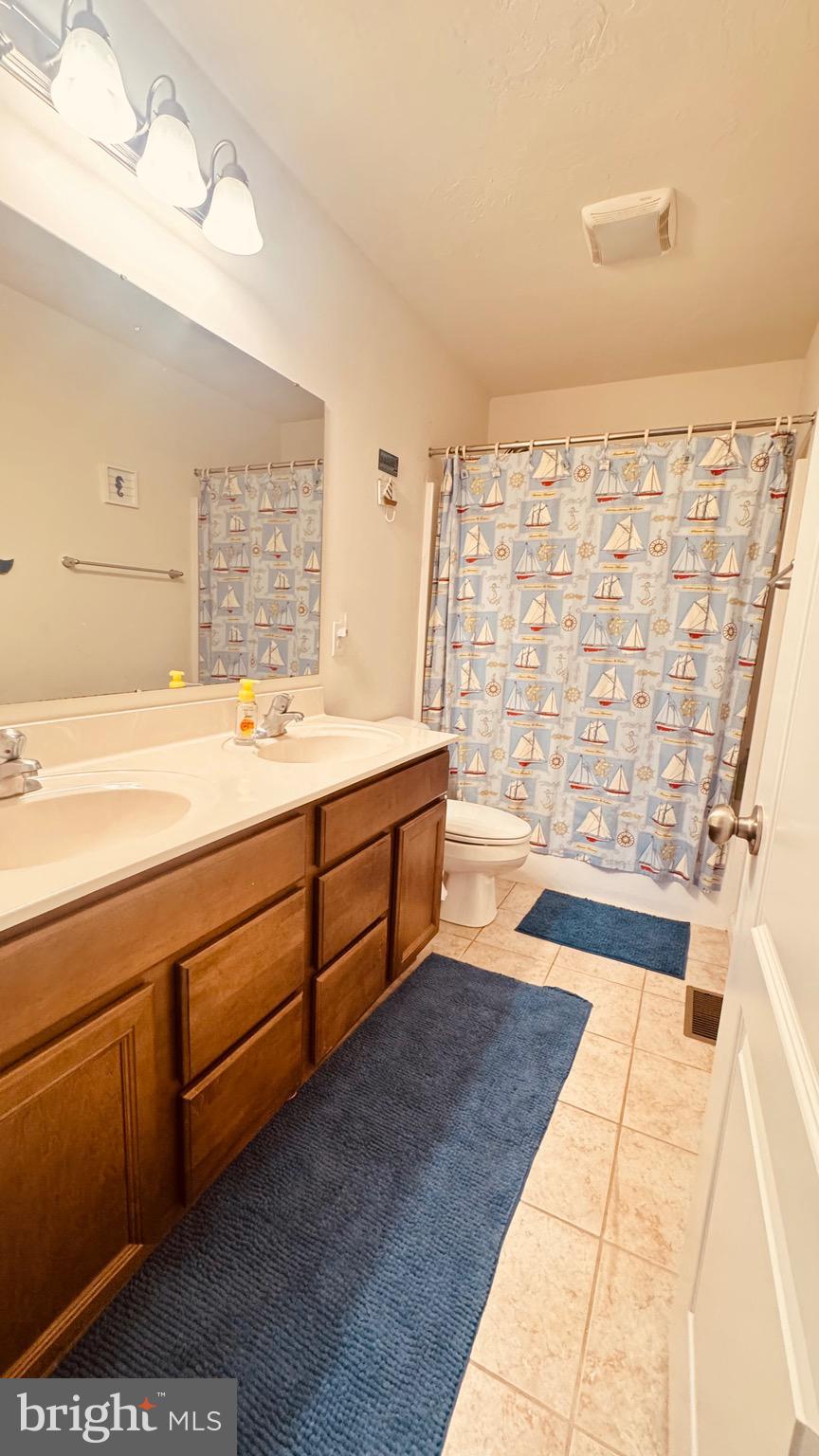 2295 Harney Road Littlestown, PA 17340 - Photo 23 of 37 a spacious bathroom with a tub sink and a shower