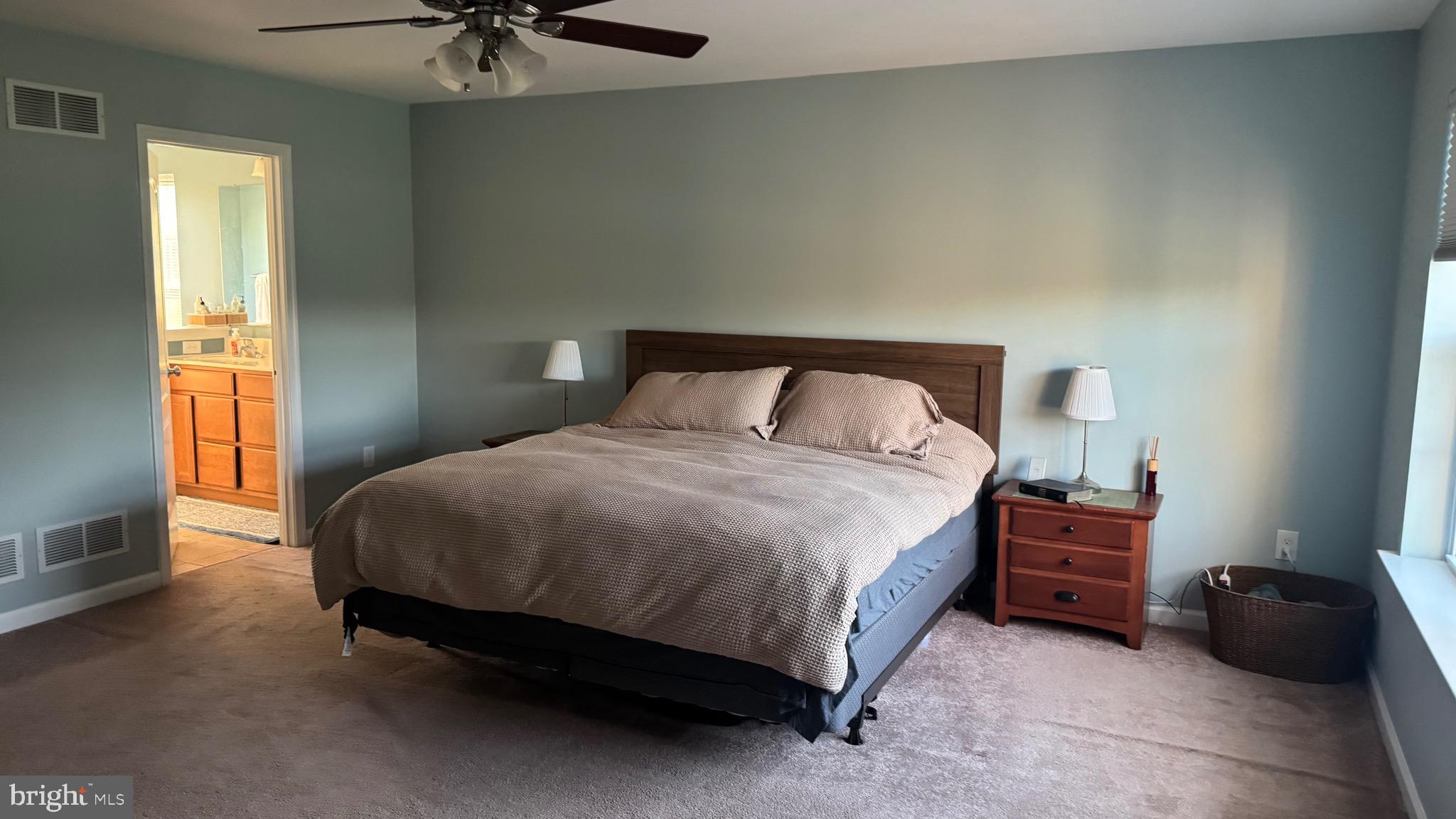 2295 Harney Road Littlestown, PA 17340 - Photo 27 of 37 a bedroom with a bed and a chandelier