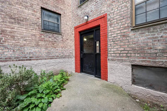 a stone house with a small yard