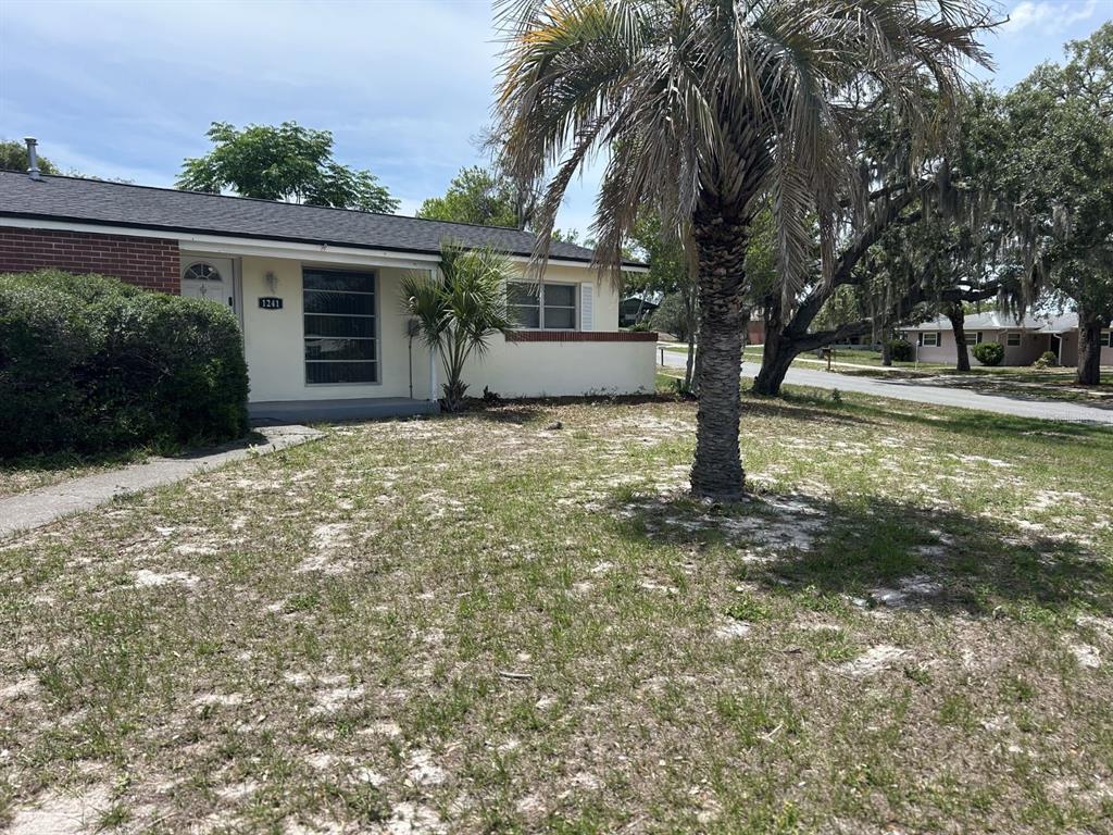 1241 Pilgrim Road Spring Hill, FL 34606 - Photo 27 of 28 front view of a house with a yard