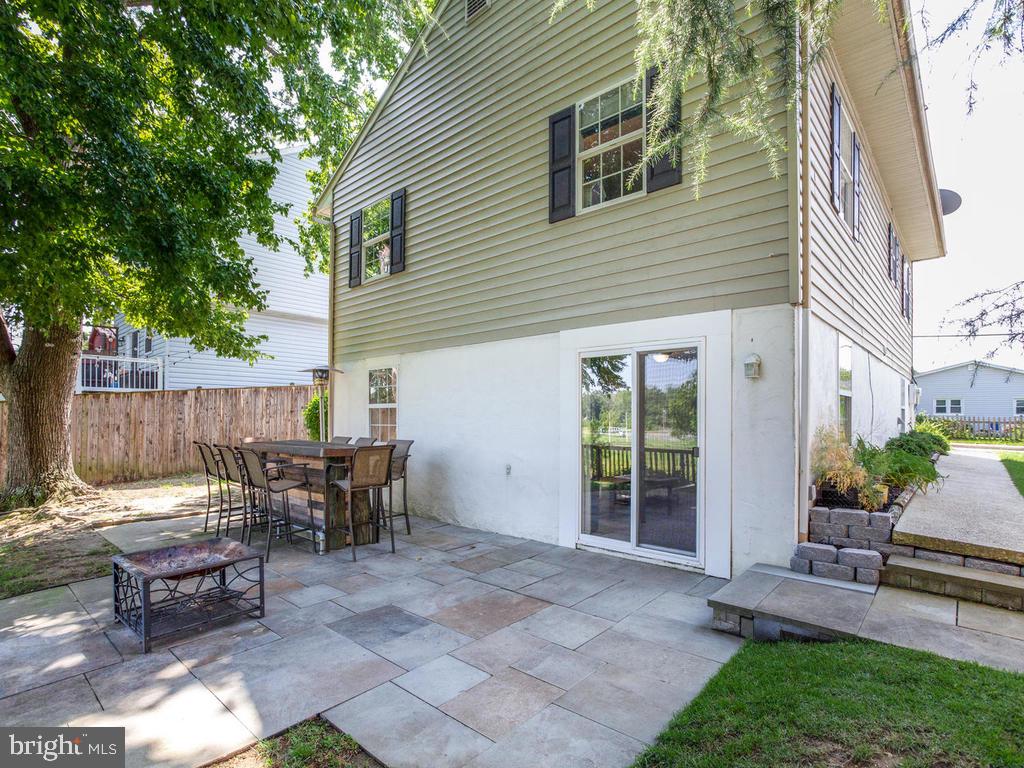 132 Oakwood Road Edgewater, MD 21037 - Photo 31 of 37 a view of a house with backyard and sitting area
