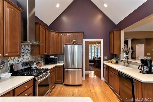 294 Chisholm Trail Rutherfordton, NC 28139 - Photo 12 of 31 a kitchen with stainless steel appliances granite countertop a stove refrigerator and sink