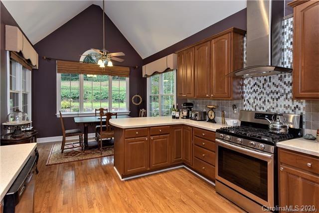 294 Chisholm Trail Rutherfordton, NC 28139 - Photo 13 of 31 a kitchen with stainless steel appliances granite countertop a stove and a wooden floors
