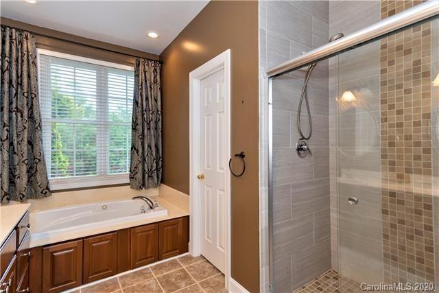 294 Chisholm Trail Rutherfordton, NC 28139 - Photo 19 of 31 a bathroom with a tub shower and sink