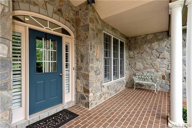 294 Chisholm Trail Rutherfordton, NC 28139 - Photo 3 of 31 a view of a porch with wooden floor and a bench