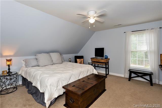 294 Chisholm Trail Rutherfordton, NC 28139 - Photo 25 of 31 a bedroom with a bed window and a chair