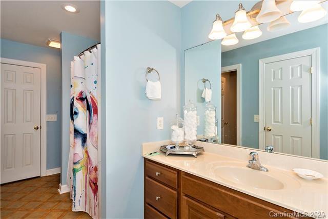 294 Chisholm Trail Rutherfordton, NC 28139 - Photo 26 of 31 a bathroom with a sink vanity and a mirror