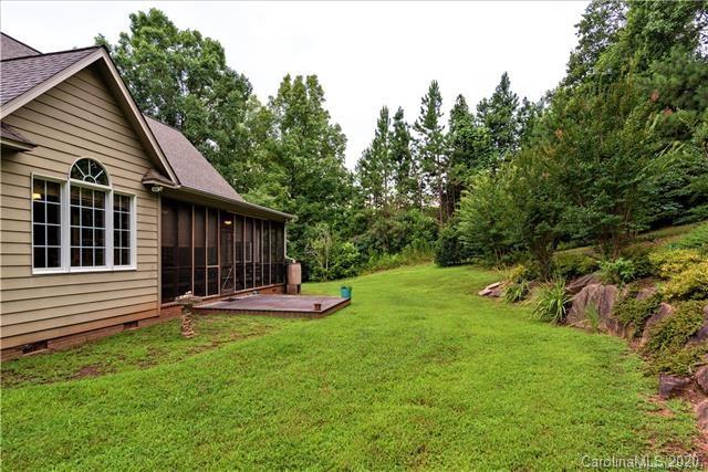294 Chisholm Trail Rutherfordton, NC 28139 - Photo 27 of 31 a view of a house with a yard and sitting area