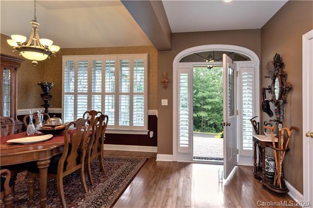 294 Chisholm Trail Rutherfordton, NC 28139 - Photo 4 of 31 a dining room with furniture a chandelier and wooden floor