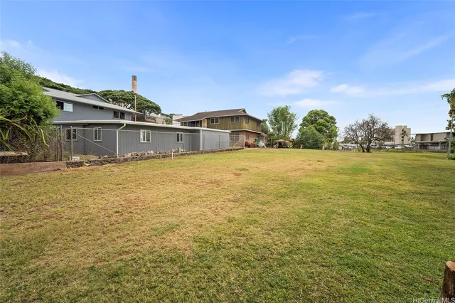 a view of a large body of water with a building in the background