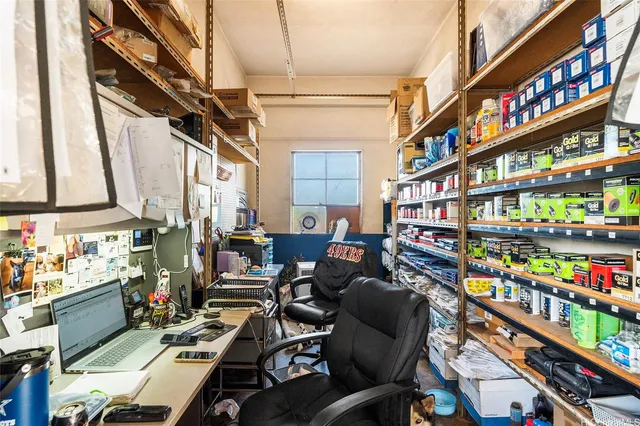 a area with furniture and a book shelf