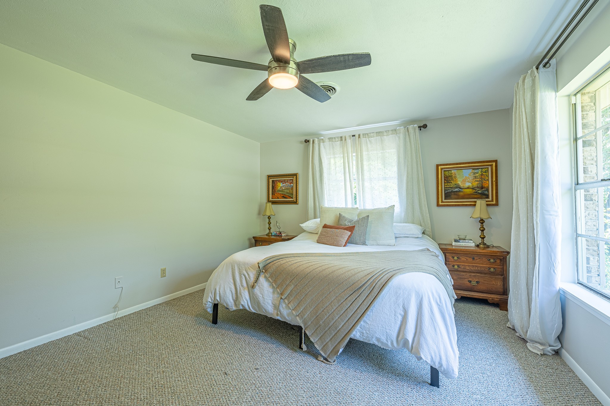 1009 Fish Hatchery Road Huntsville, TX 77320 - Photo 12 of 16 a bedroom with a bed and window